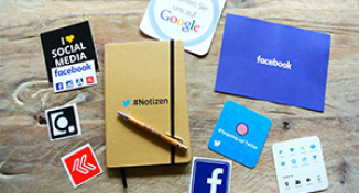 Imagen de  Pieces of paper advertising Facebook, Twitter and Google